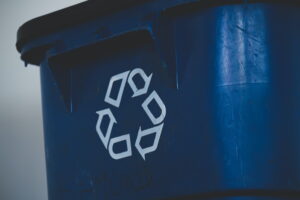 Blue bin with recycling sign on to show technology recycling